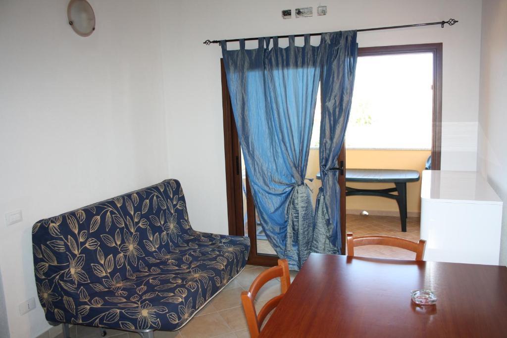 Appartamenti Ideal Isola Rossa Værelse billede